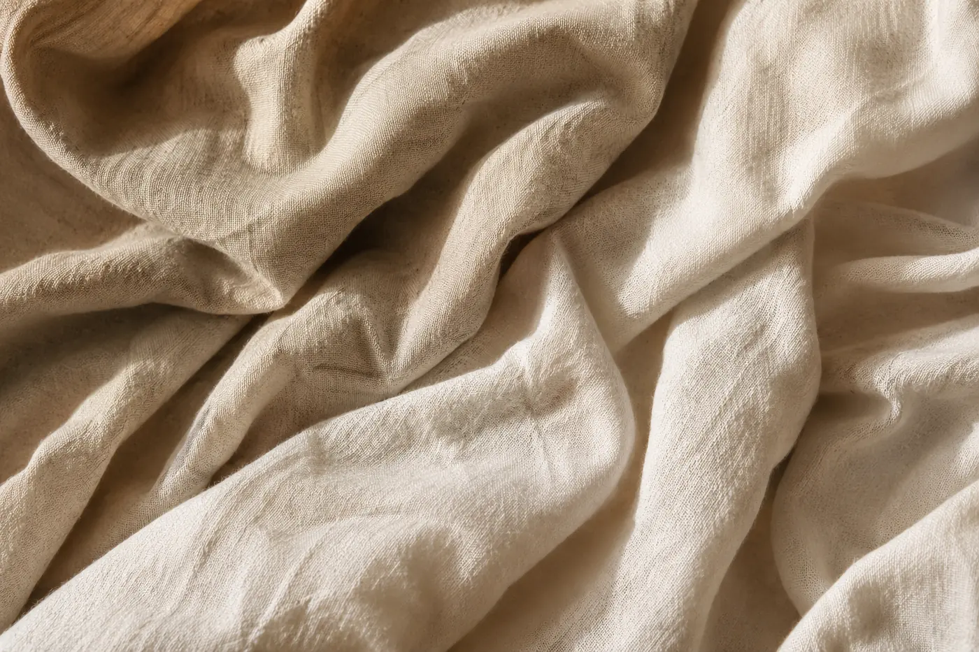 Warm natural linen folded into gentle contours